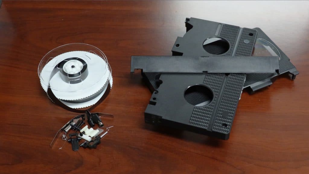 Separated plastic parts of a VHS tape to recycle